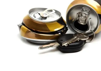 a crushed beer can and car keys