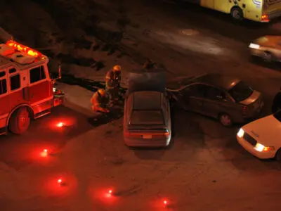emergency flares surrounding a car crash