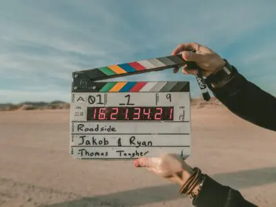 person holding movie marker clapper