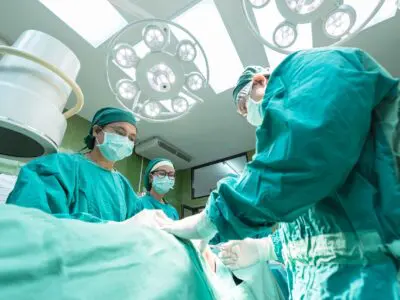 several doctors performing surgery