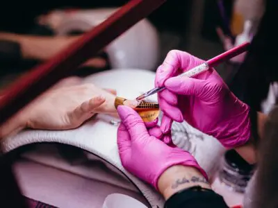 manicurist painting someone's nails