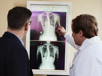 doctor and patient looking at x-rays