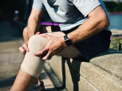 person wearing bandage on injured knee