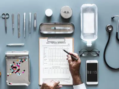person filling out a medical device checklist