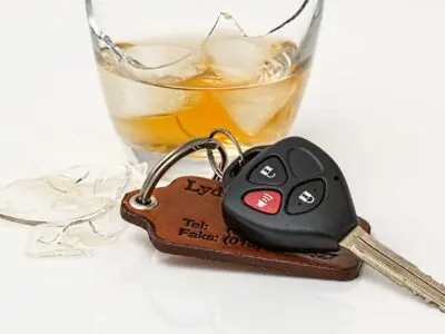 car key fob sitting next to a cocktail