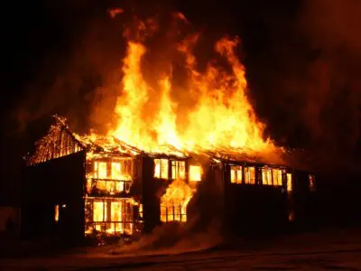 apartment complex completely engulfed in flames