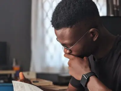 man filling out a scholarship application
