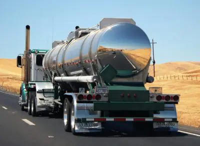 behind view of a large semi truck on a road