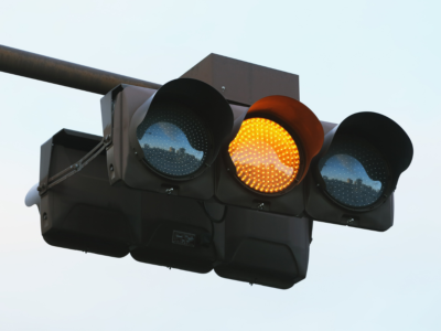 Yellow traffic light at an intersection, representing Georgia yellow light laws and fault in intersection accidents.
